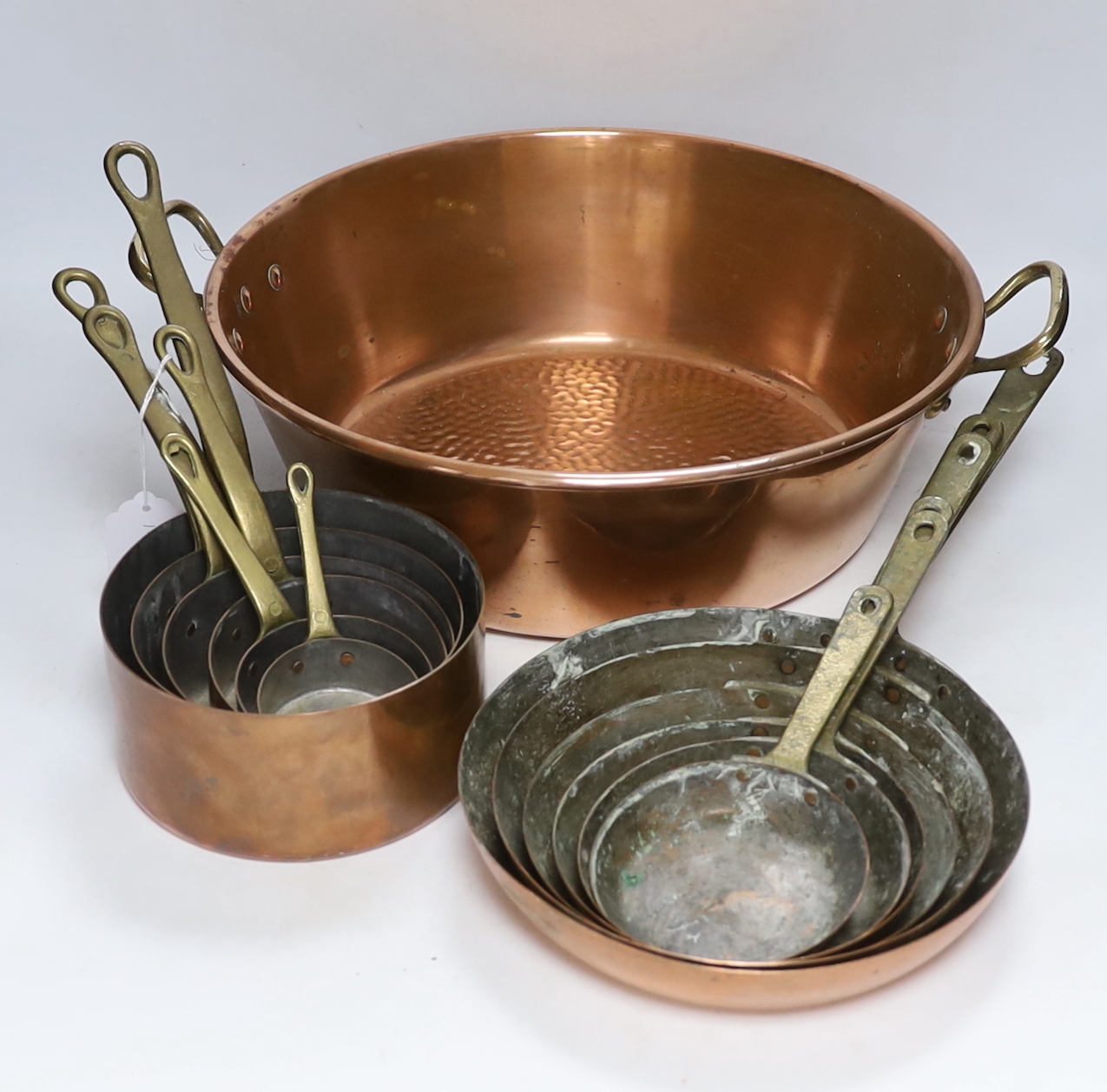A set of 6 graduated saucepans and a similar and a 2 handled preserve pan, 45cm